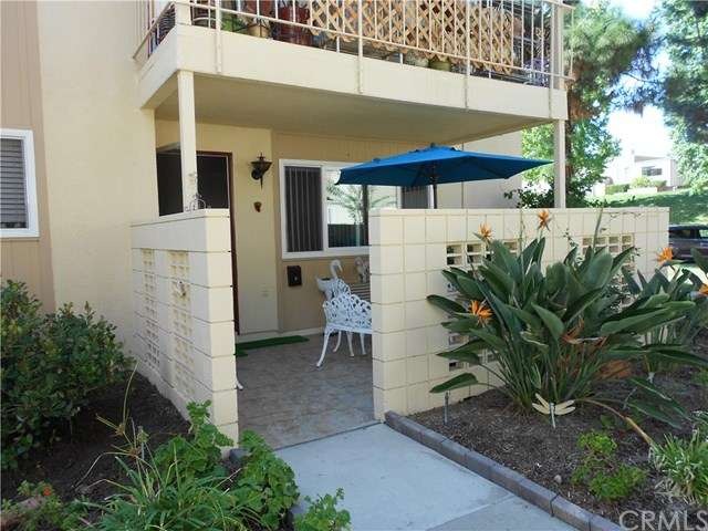 Covered patio with lots of flowers and plants all 