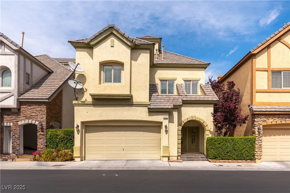 View of front of home featuring stucco siding, a g