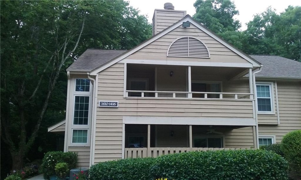 Upstairs end unit with a balcony