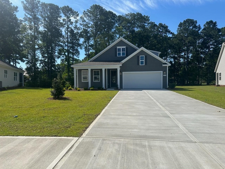 View of front of home featuring a front yard and a