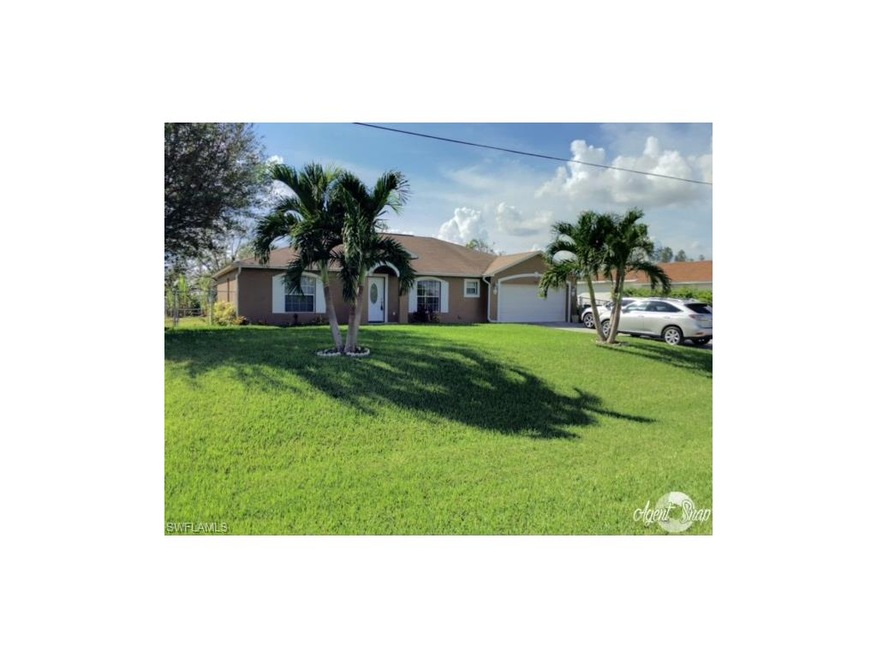 Frontal Elevation with beautiful Bermuda Grass.  H