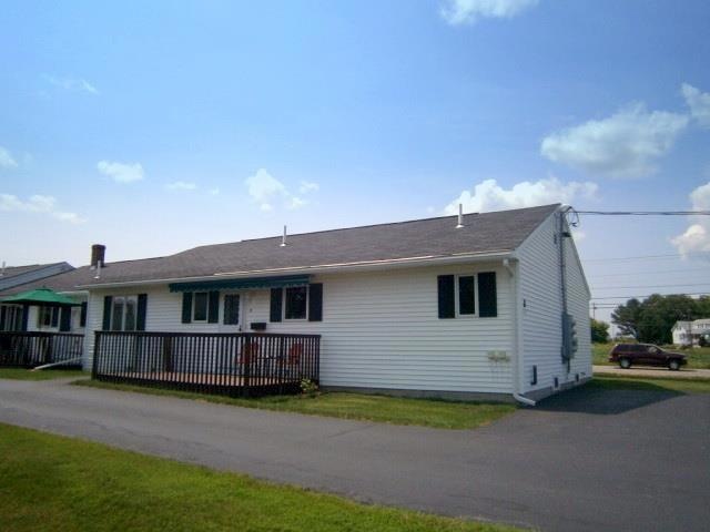 Front of home with deck. Deck has...
