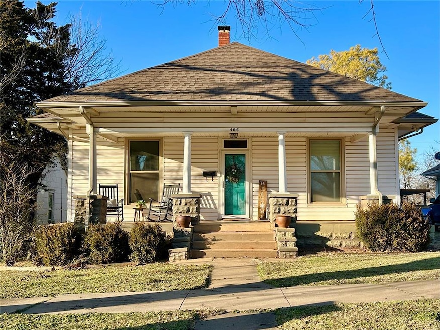 Bungalow-style home with covered porch, a shingled