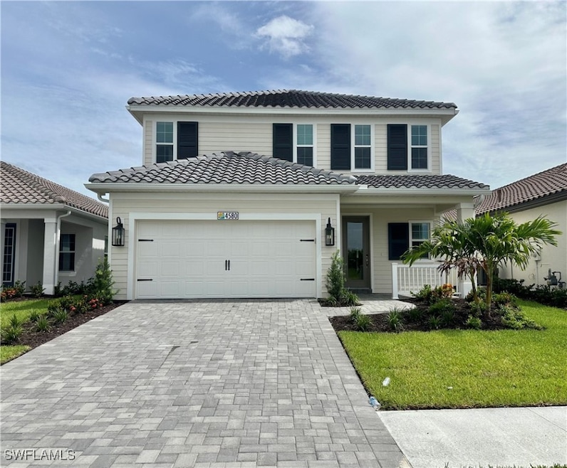 Mediterranean / spanish home with a front yard and