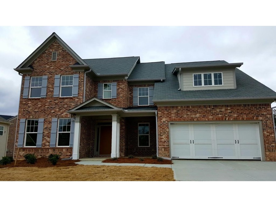 The Primrose at homesite 13B has a brick and Hardi