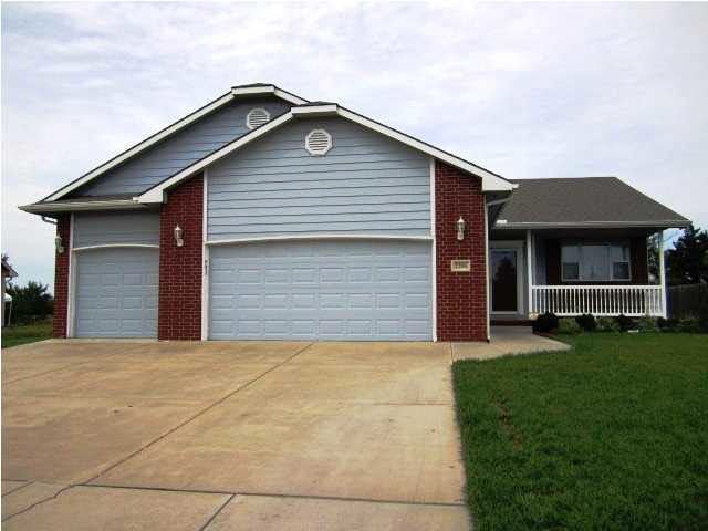 Front of stunning home with 3 car attached garage 