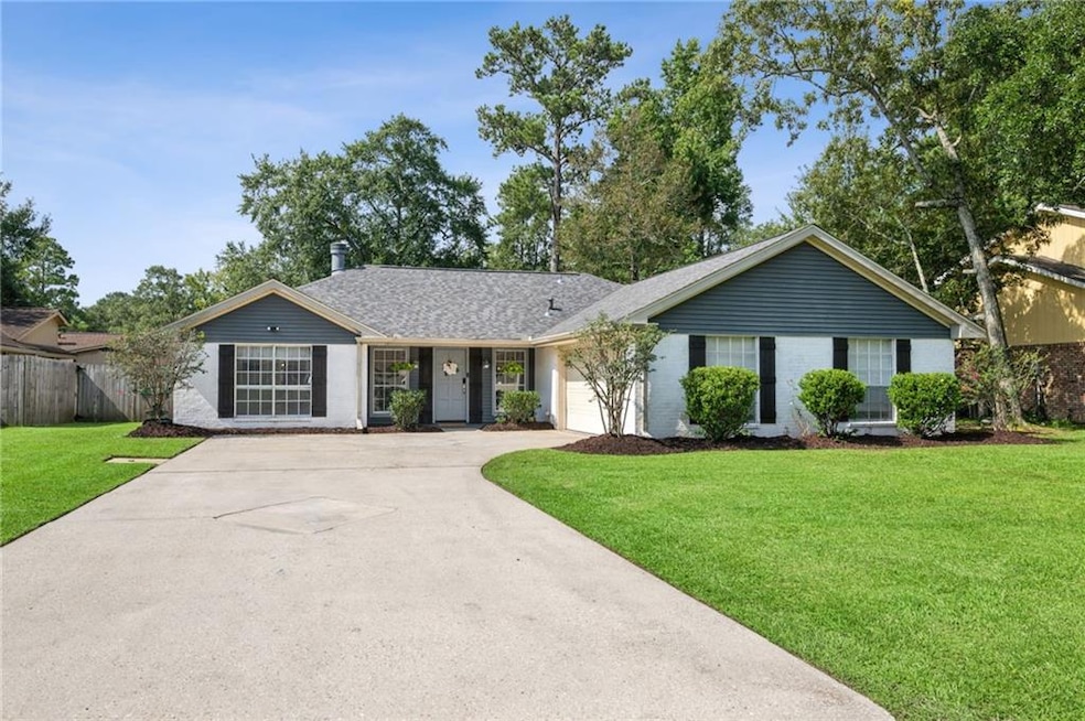 Freshly updated exterior with charming curb appeal, crisp paint, and manicured landscaping.