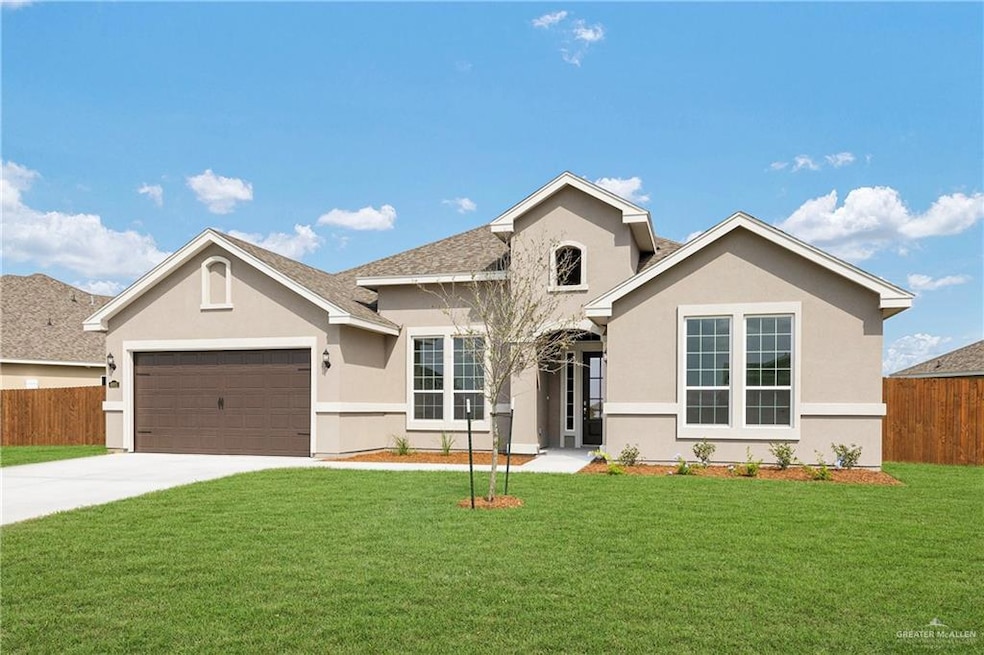 View of front facade with stucco siding, concrete driveway, an attached garage, and a shingled roof