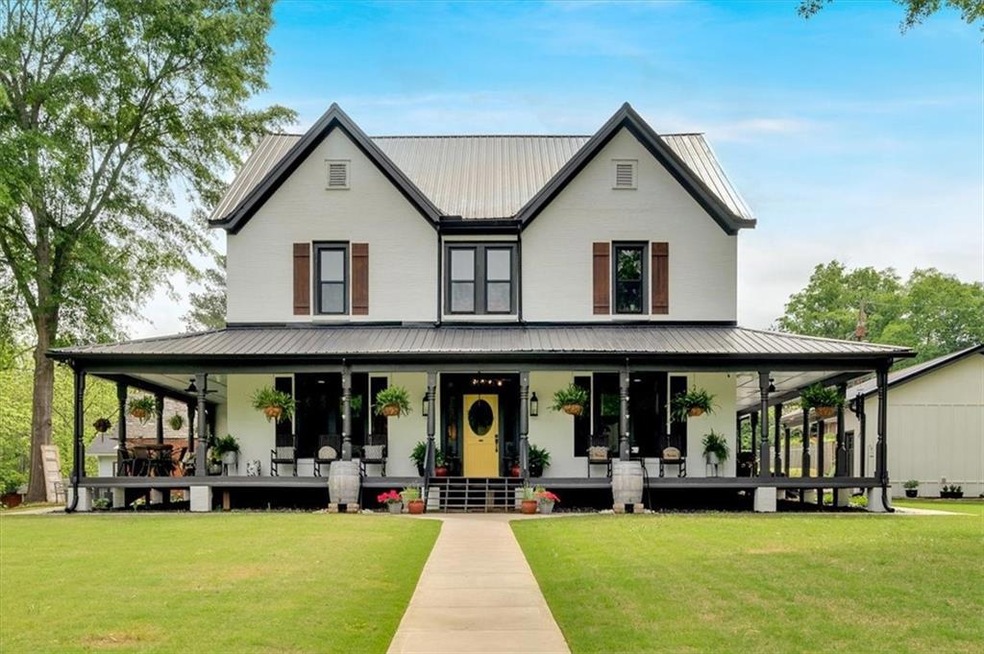 View of front of property featuring a porch, a fro