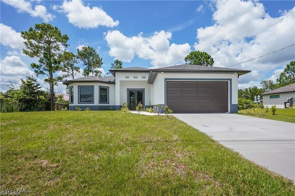 Prairie-style house with stucco siding, concrete d