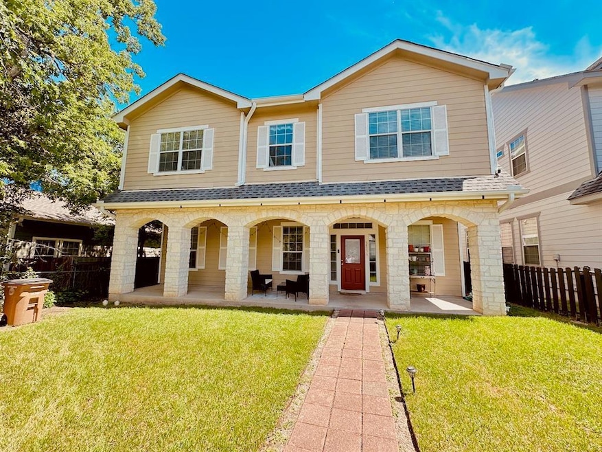 View of front of home featuring fence, a shingled