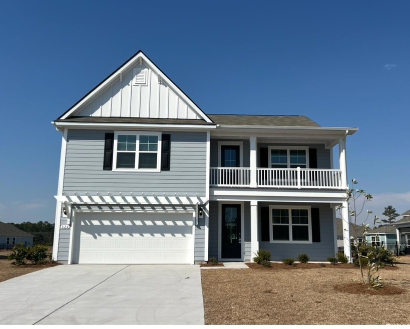 View of front of property featuring board and batt