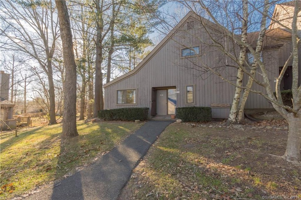 Private end unit townhouse in woodland setting