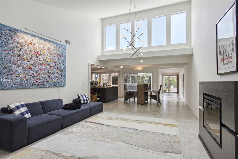Living room featuring a towering ceiling and a not