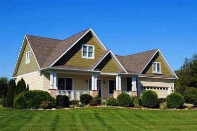 Craftsman style home with maintenance free cement board siding and New England style shakes. English Organic perrennial garden. Covered front porch.
