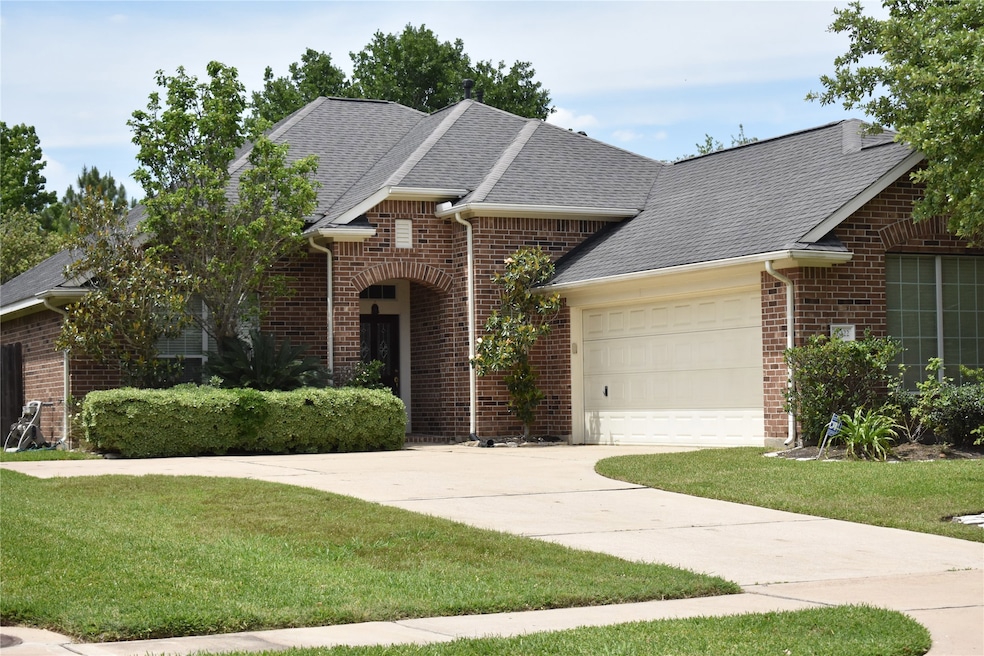 Front elevation with a side loading garage.