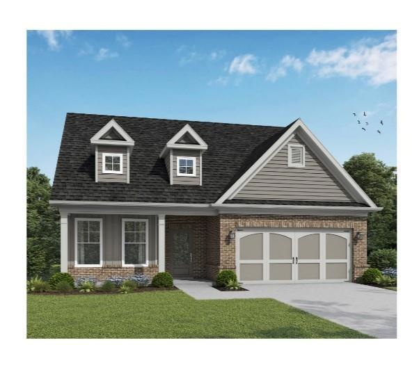 Cape cod-style house with brick siding, an attache