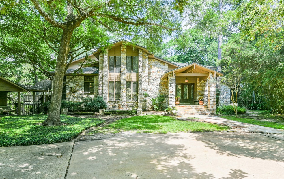 Gorgeous stone elevation nestled among the wooded lot!