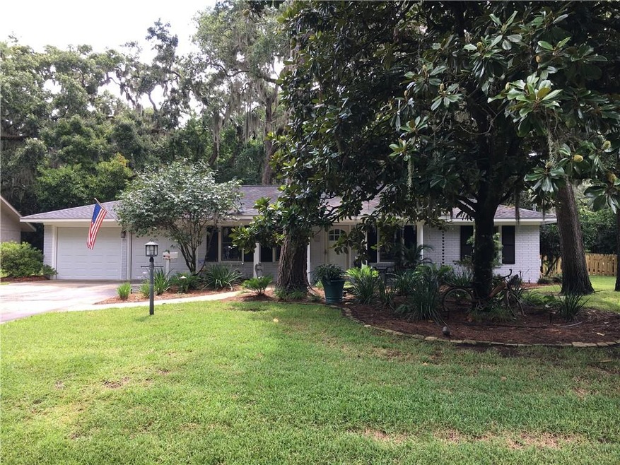 Beautifully landscaped corner lot with fenced in b