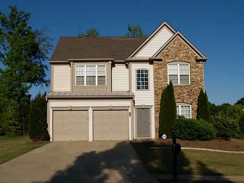 Exterior Front. Stack stone and Hardi plank