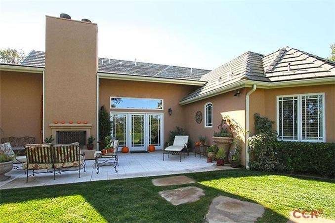Patio with outdoor fireplace and built in bar-b-qu