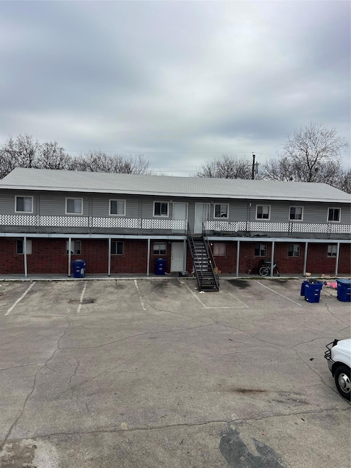 View of front of property with uncovered parking,