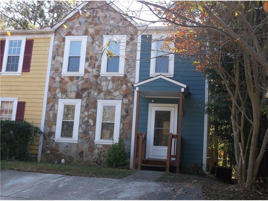 Covered front stoop with 2 car driveway parking