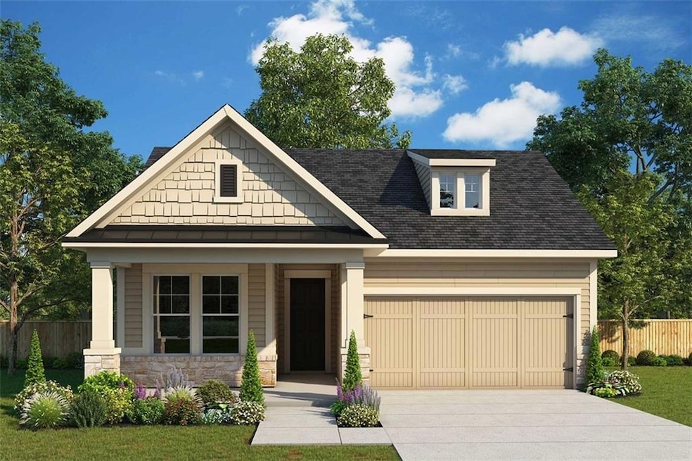 Craftsman house featuring a garage and a front law