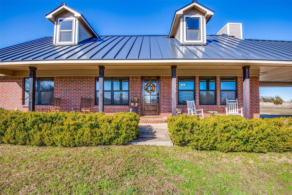 Welcoming entry with covered patio