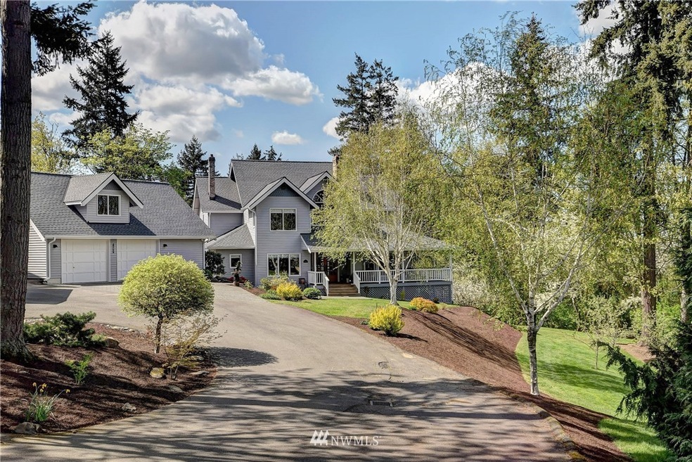 Private country setting! Coveted Northshore school district circular driveway making it easy to pull in big RVs, boats and more. Two car garage with extra storage space above. Beautifully mature landscaping.