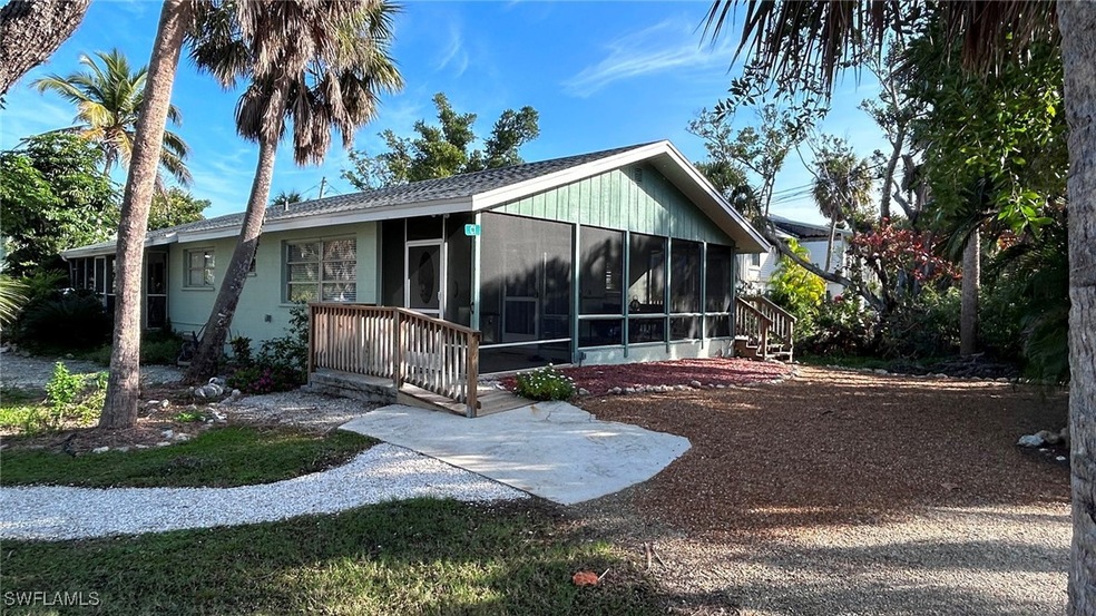 Back of house featuring a sunroom