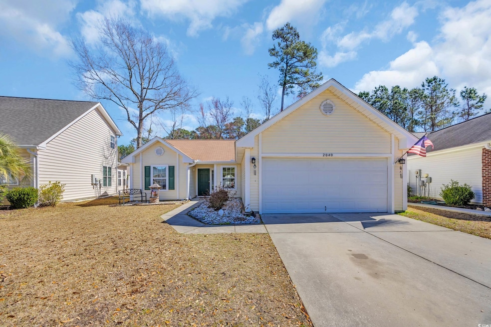 Ranch-style home with a front lawn, driveway, and 