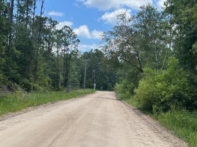 Unpaved road borders the south side and is in grea