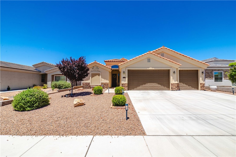 View of front of property featuring an attached ga