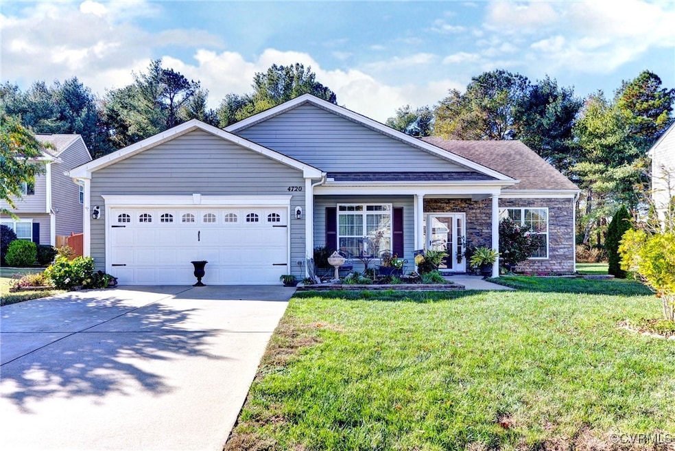View of front of property featuring a garage and a