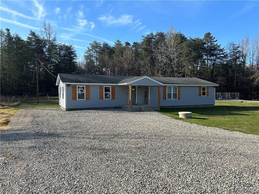 Single story home with a front lawn