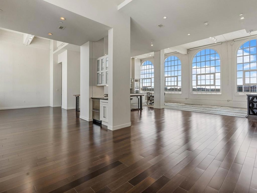 Stunning Great room with hardwood flooring, soarin