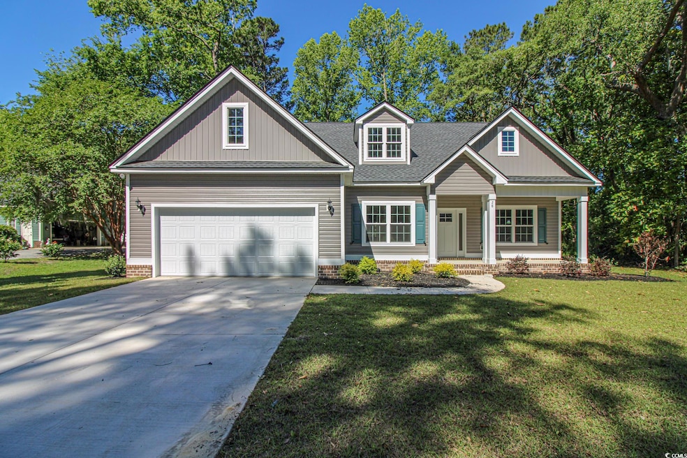 Craftsman-style home with a garage, covered porch,