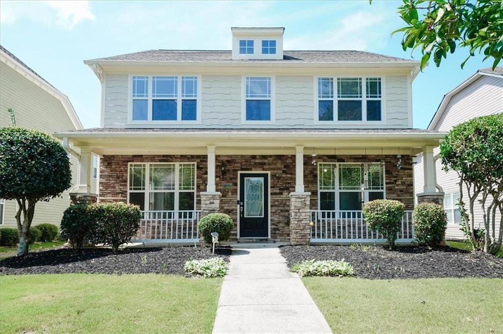 View of front of property with covered porch and a