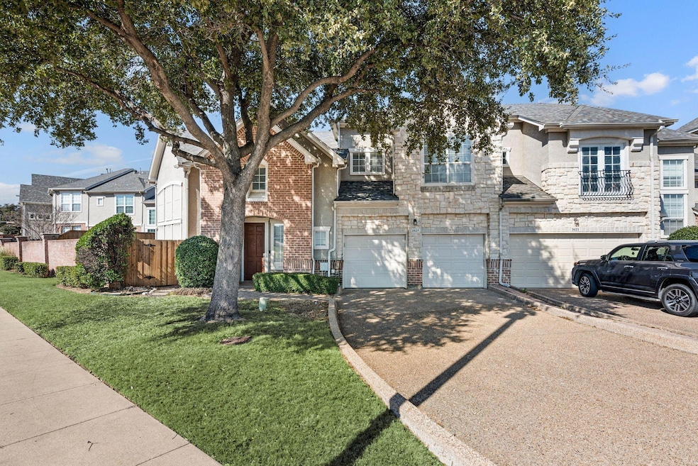 View of front facade with driveway, an attached ga