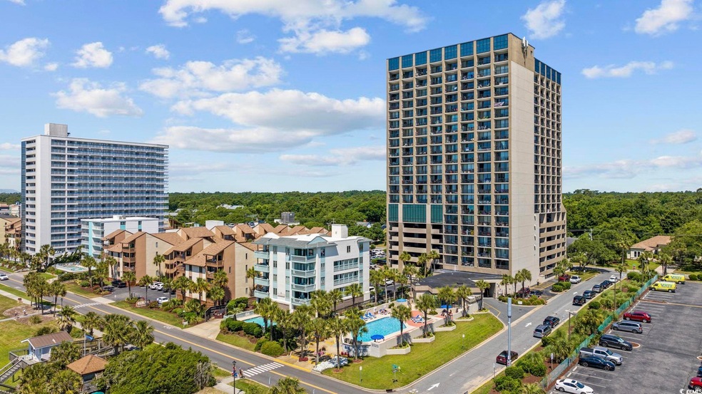 View of building exterior featuring a city view