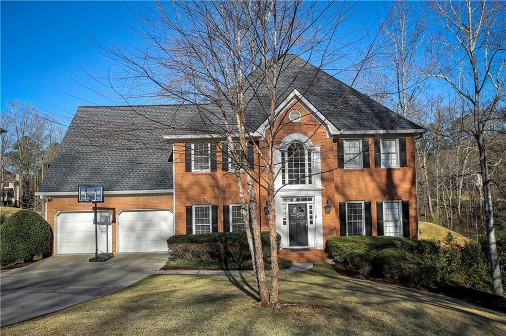 Elegant 3-side brick home overlooking the 3rd gree