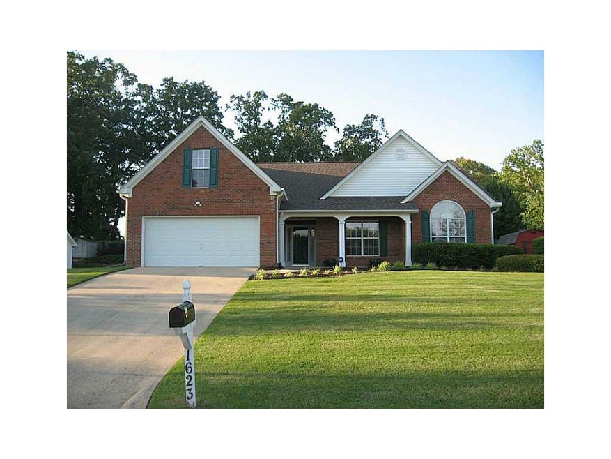Exterior Front. The sprawling front lawn perfectly