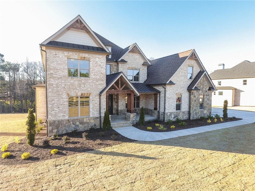 4 sides brick with stone and cedar accents