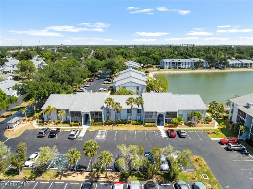 Bird's eye view with a water view and a residentia