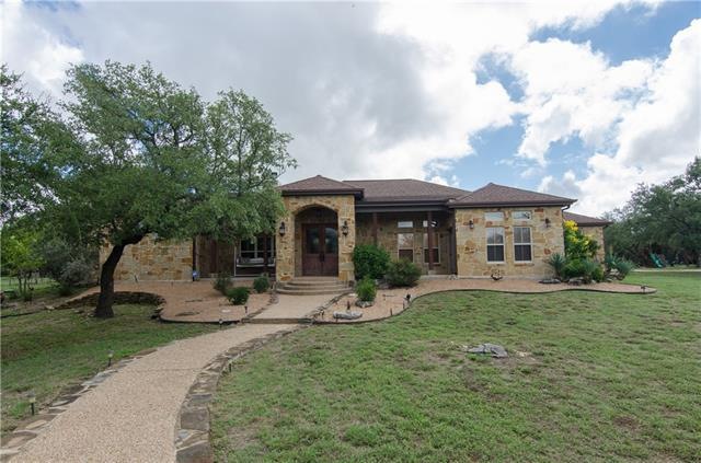 Beautiful stone home with high-end aggregate walkw