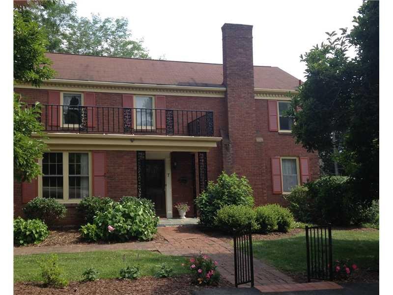 Exterior Front. Classic three bedroom brick coloni