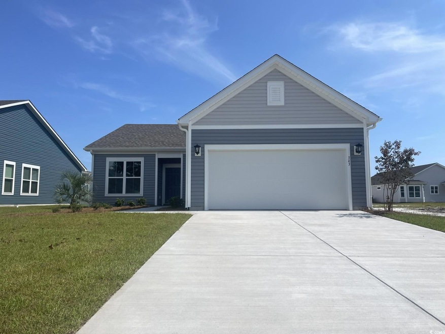 Single story home with a garage and a front yard