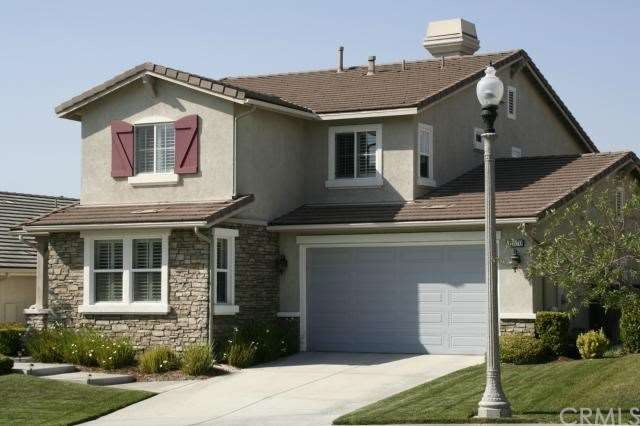 This home has stone facade, steps leading from the