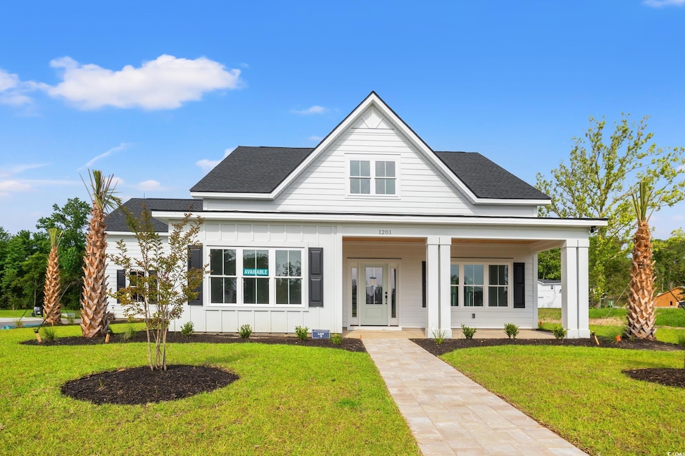View of front facade with board and batten siding,